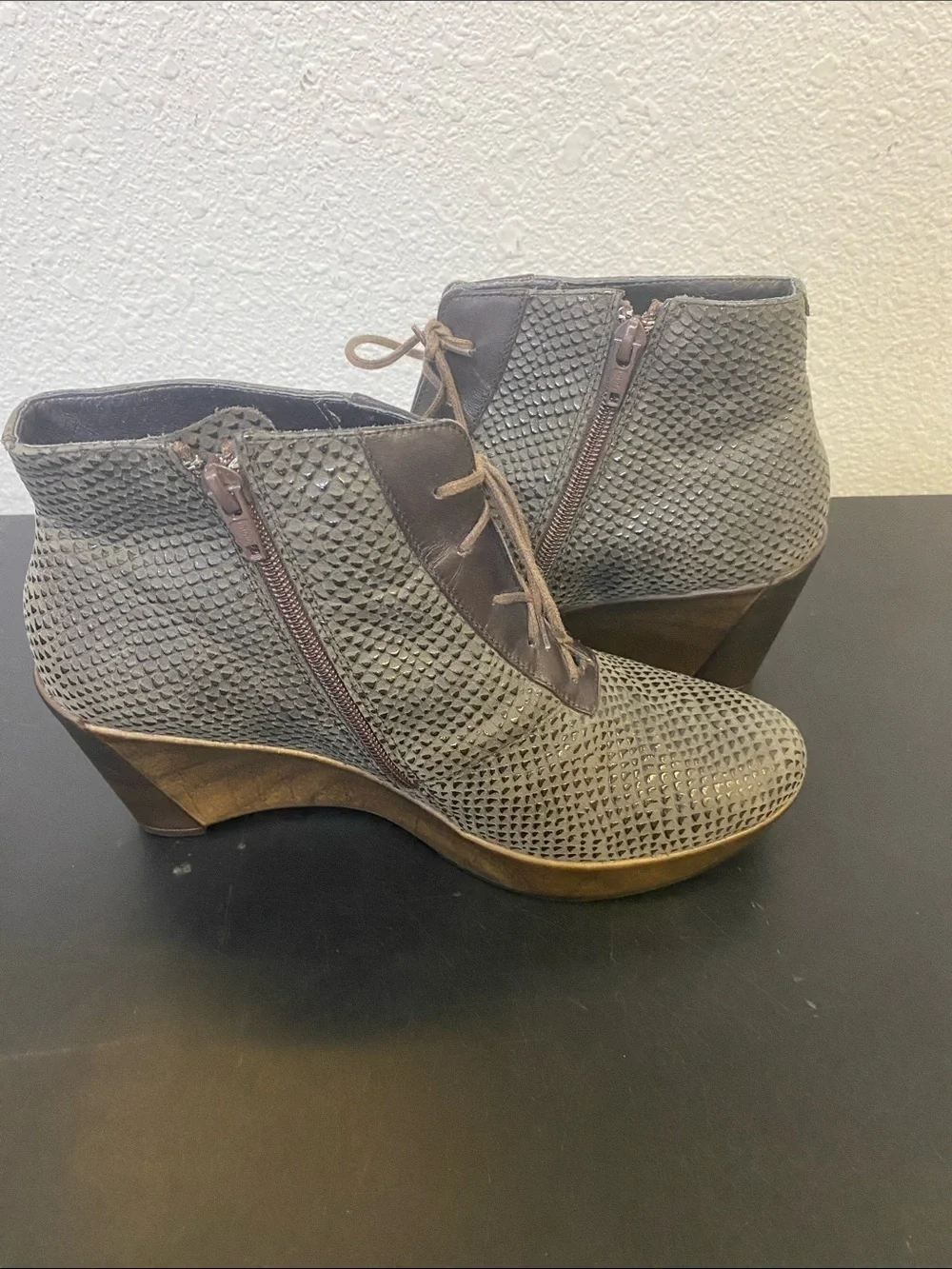 The boots in the image are the Naot Nadine Wedge Bootie,